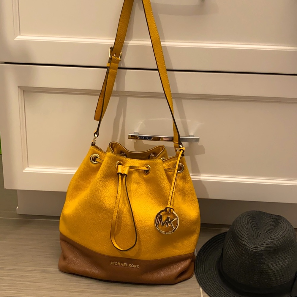 Michael Kors bucket bag , tan and mustard color.